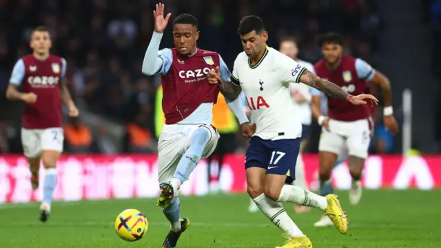 Cristian Romero of Tottenham Hotspur in action with Ezri Konsa of Aston Villa