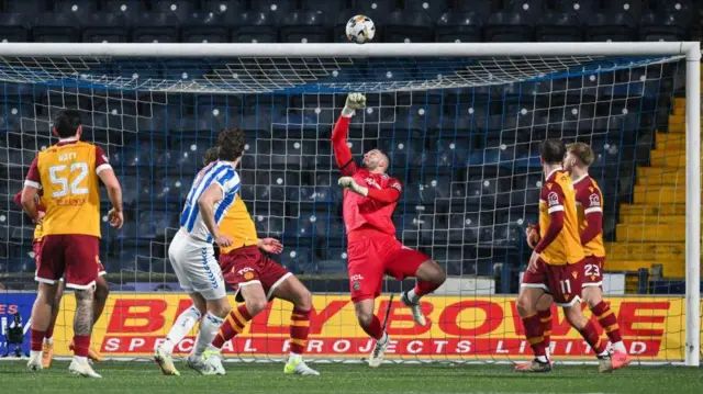 Motherwell's Aston Oxborough saves a shot from Kilmarnock's Joe Wright during a William Hill Premiership match between Kilmarnock and Motherwell