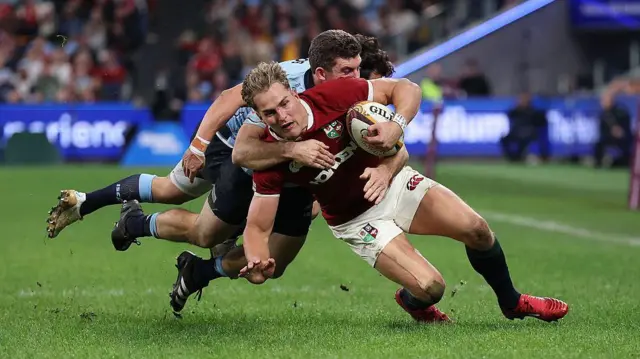 Duhan van der Merwe of the British & Irish Lions is tackled by Lawson Creighton