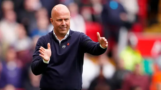 Arne Slot gestures on the touchline