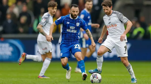 Joe Allen shields the ball from Manolis Siopis during the most recent south Wales derby