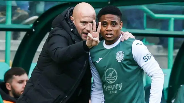 Hibernian head coach David Gray (L) and Thibault Klidje during a William Hill Premiership match between Hibernian and Livingston at Easter Road