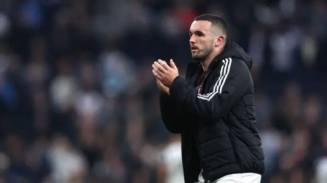 John McGinn of Aston Villa applauds the fans after the Premier League match between Tottenham Hotspur FC and Aston Villa FC at Tottenham Hotspur Stadium