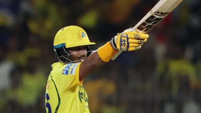 Kartik Sharma raises his bat