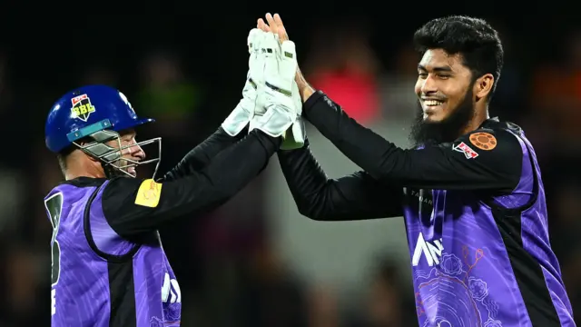 Rishad Hossain and Matthew Wade celebrate a wicket