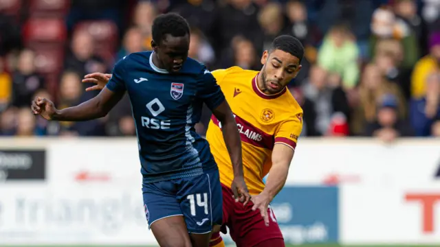 Ross County's Victor Loturi (L) and Motherwell's Brodie Spencer in action during a cinch Premiership match between Motherwell and Ross County 