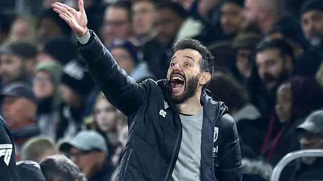 West Brom manager Carlos Corberan gesticulates to his players from the sidelines