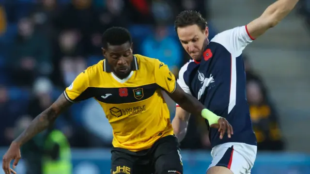 Livingston's Jeremy Bokila and Falkirk's Liam Henderson