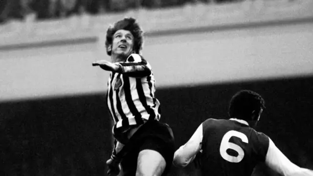Wyn Davies leaps and heads past Peter Simpson