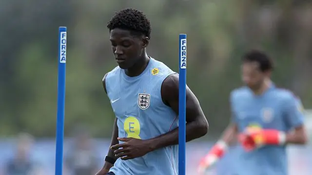 Kobbie Mainoo of England runs with the ball during a training session
