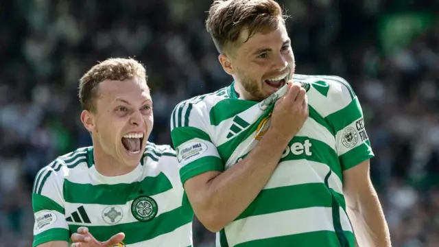 Alistair Johnston (left) celebrates with Celtic goalscorer James Forrest (right)