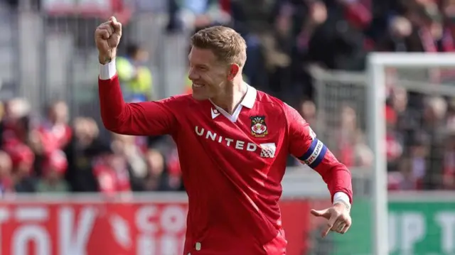 Wrexham's left wing-back James McClean celebrates