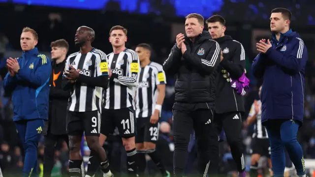Newcastle players applaud after their Carabao Cup exit