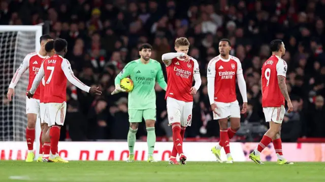 Arsenal players look dejected after conceding