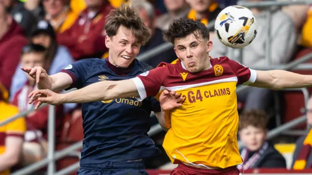 Hearts' James Penrice and Motherwell's Tom Sparrow