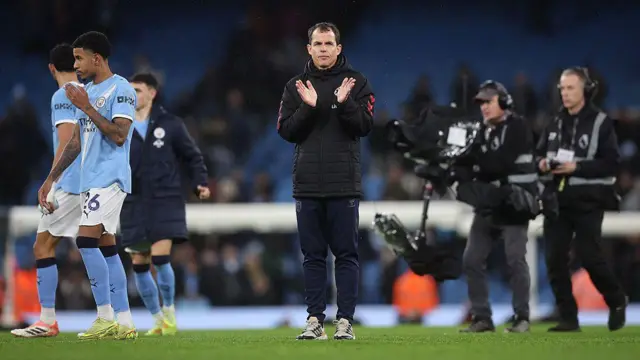 Sunderland Manager Regis Le Bris applauds the away fans after losing at Manchester City