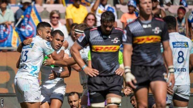 Joe Marchant is congratulated by All Black wing Reiko Ioane after scoring a try against South Africa's Stormers