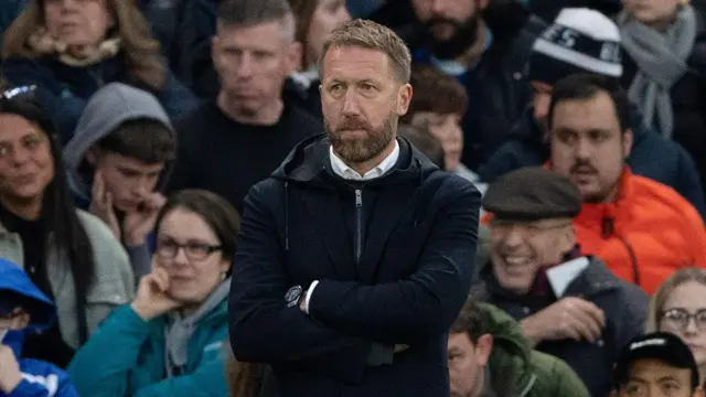 Graham Potter watches from the dugout