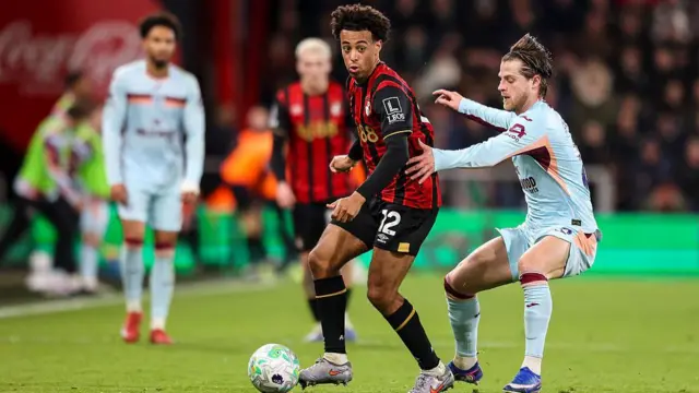 Tyler Adams holds off the challenge of Mathias Jensen