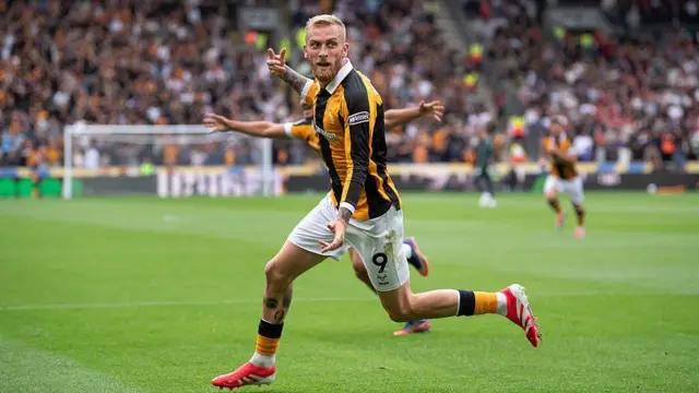 Oliver McBurnie and Mohamed Belloumi of Hull City celebrate the first goal during the Premier League 2026/27 match between Hull City and Manchester United.