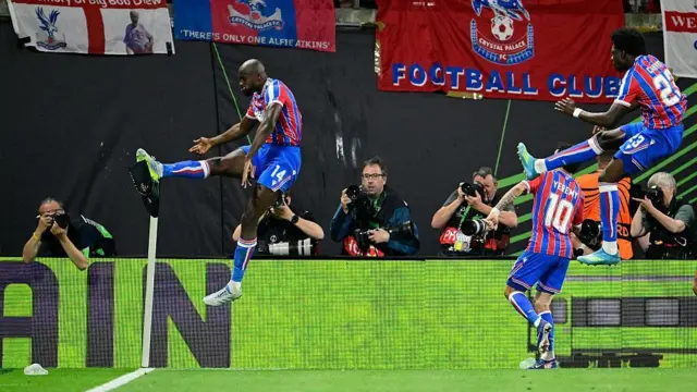  Jean-Philippe Mateta kicks a corner flag to celebrate
