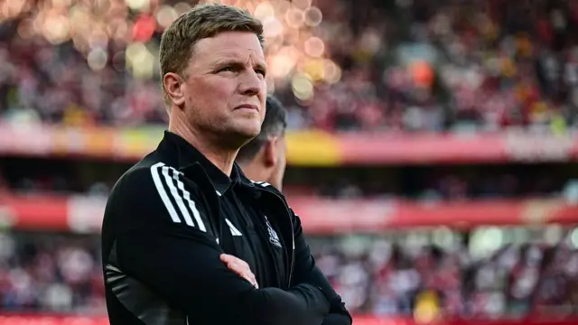 Eddie Howe standing with his arms folded 