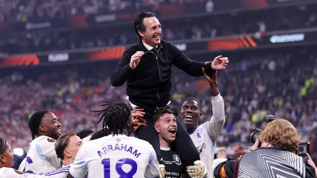 Unai Emery, Manager of Aston Villa, celebrates on the shoulders of Emiliano Martinez of Aston Villa after the team's victory in the Europa League Final.