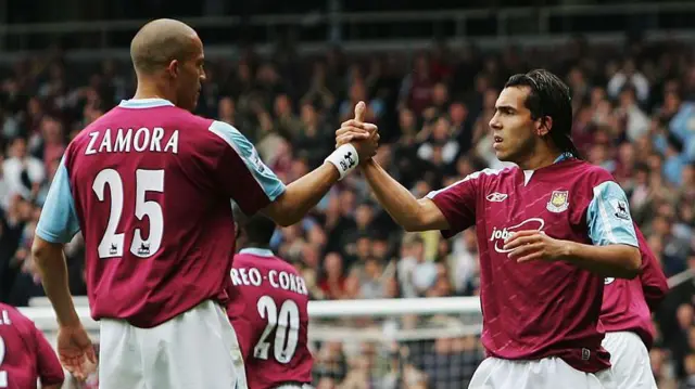 Carlos Tevez celebrates scoring with team mate Bobby Zamora