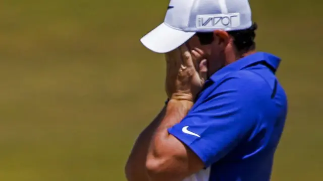 Rory McIlroy reacts after missing a putt