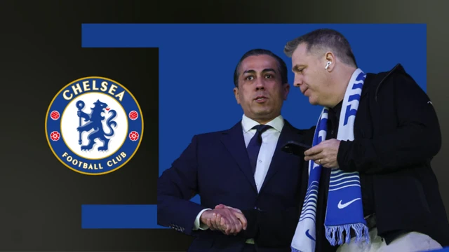 Chelsea's owners shake hands in a directors' box