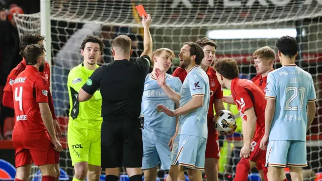 Motherwell's Oscar Priestman was sent off after three minutes at Pittodrie