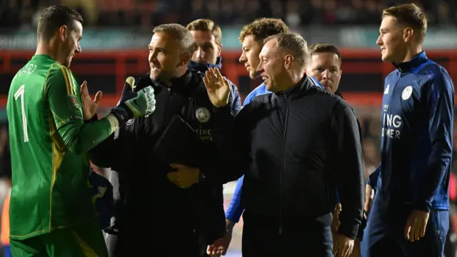 Steve Cooper and Leicester players celebrate their win over Walsall in the Carabao Cup