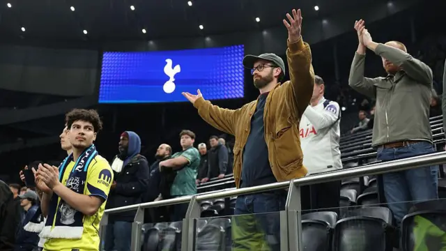 Supporters of Tottenham Hotspur look dejected