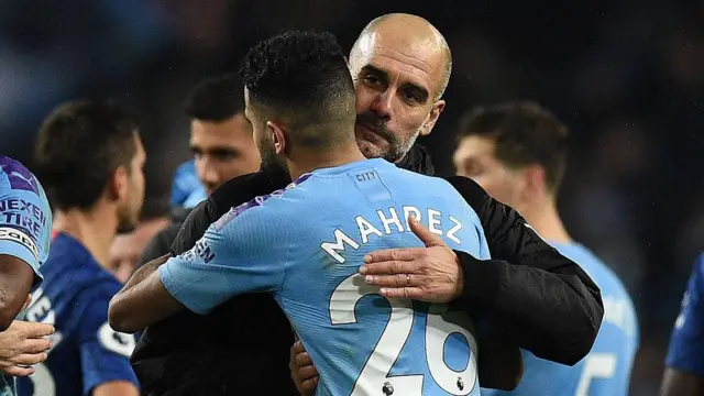 Pep Guardiola embraces Riyad Mahrez