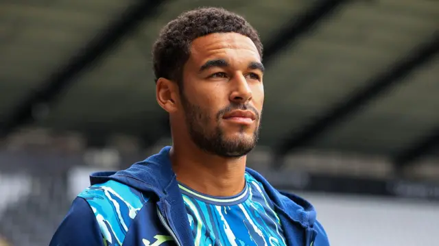 Ben Cabango arrives at a game last season