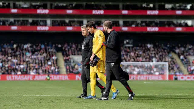 Alisson Becker of Liverpool F.C. injured during the Premier League match between Crystal Palace FC and Liverpool FC at Selhurst Park