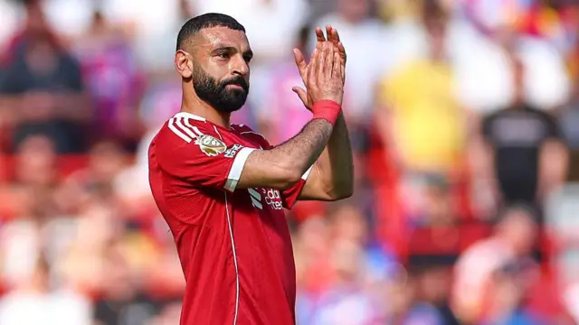 Mohamed Salah of Liverpool applauds the fans