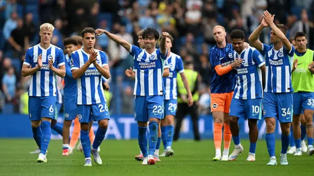 Brighton players celebrate after beating Manchester City