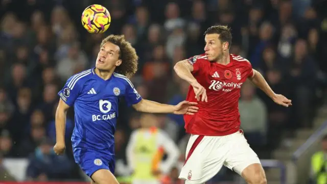 Wout Faes heads the ball into the path of Chris Wood