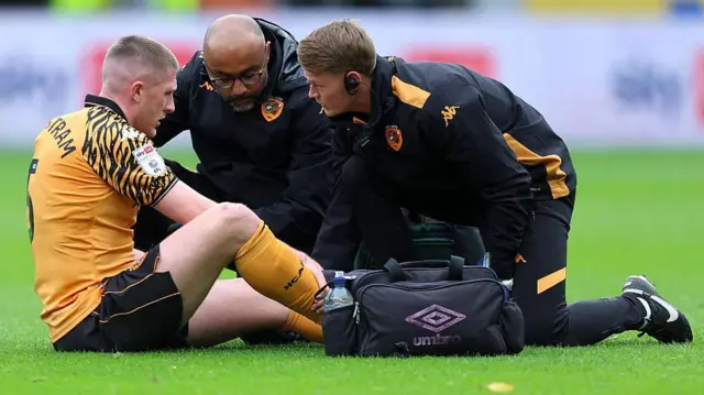 John Lundstram receiving medical attention during Hull City's match against Sheffield United