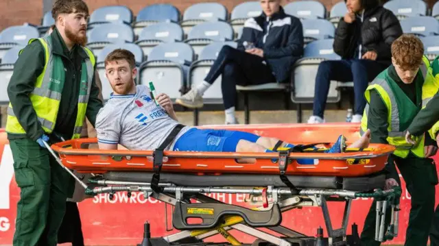 Kilmarnock's Stuart Findlay was stretchered off at Dundee on Sunday