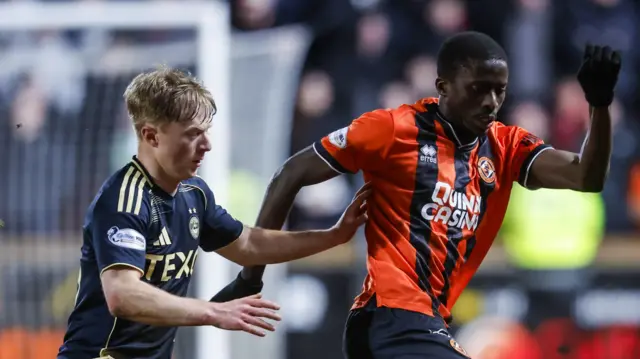 Aberdeen's Lyall Cameron and Dundee United's Panutche Camara