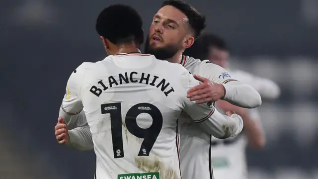 Florian Bianchini celebrates Tuesday's win over Watford with Matt Grimes