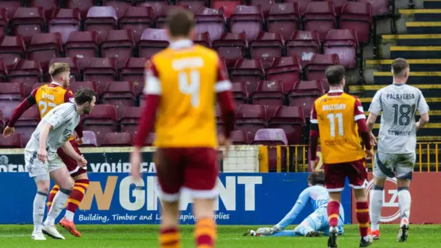 Wilson (left) scores to make it 1-0
