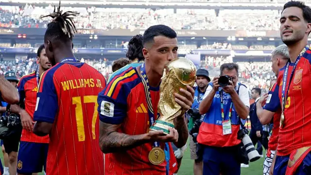 Pedro Porro of Spain celebrates 