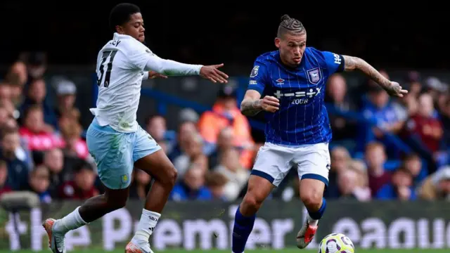 Aston Villa's Jamaican striker #31 Leon Bailey vies for the ball with Ipswich Town's English midfielder #08 Kalvin Phillips during the English Premier League football match between Ipswich Town and Aston Villa at Portman Road