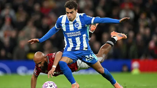 Yasin Ayari in action against Manchester United's Bryan Mbeumo