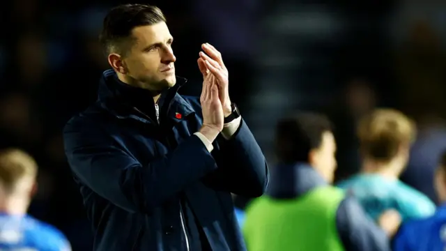 Portsmouth manager John Mousinho claps the fans after the 3-1 win against Preston North End in the Championship