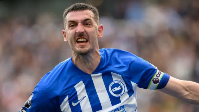 Lewis Dunk celebrates Joao Pedro's winner against Aston Villa