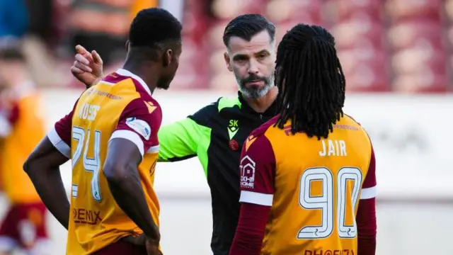 Motherwell's Moses Ebiye (L) and Jair Tavares (R) and Manager Stuart Kettlewell at full time during a William Hill Premiership match between Motherwell and Dundee at Fir Park,